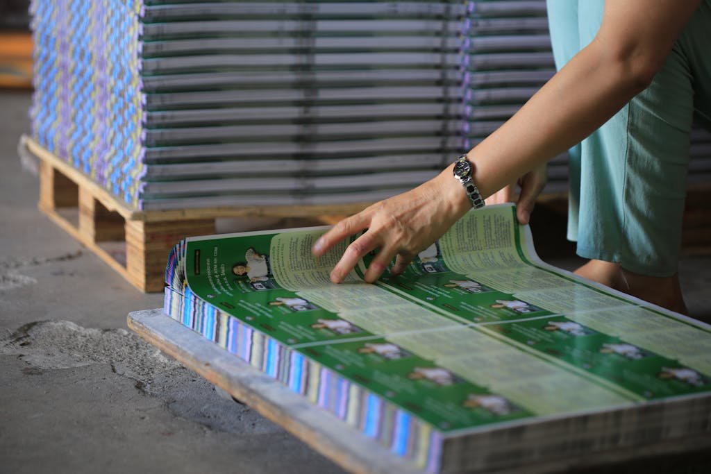 Man Looking at New Printed Papers